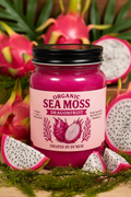 A jar of Dragonfruit Sea Moss supplement by Created by De'Nese, styled with fresh dragonfruit slices on a clean white background.